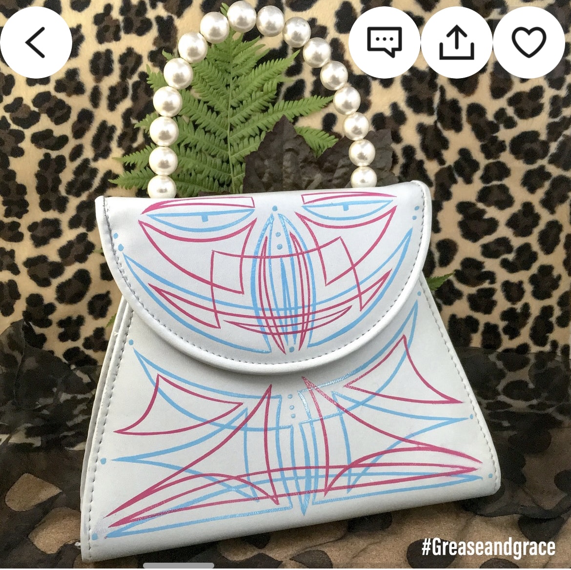 uniquely shaped white vintage purse with pink and blue pinstriping by Grease and Grace with beaded handle